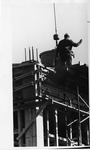 Worker guiding machinery to pour concrete by SUNY Geneseo