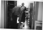 Library staff setting up Fraser Hall Library (interior) by SUNY Geneseo