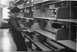 Library staff setting up Fraser Hall Library (interior) by SUNY Geneseo