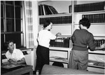 Shelf reading after moving into Fraser Hall Library (interior) by SUNY Geneseo